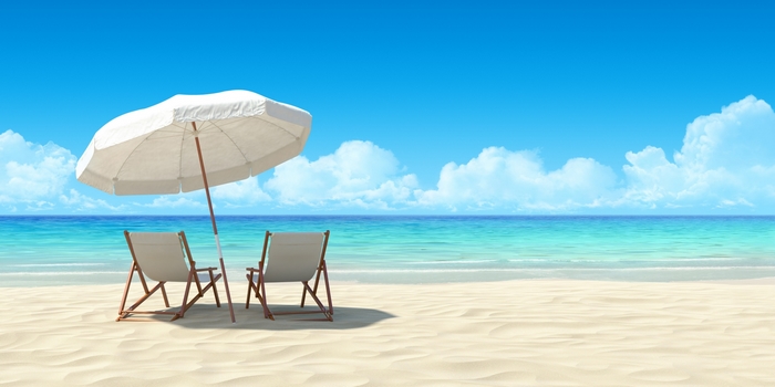 Beach chairs and umbrella on a sandy beach
