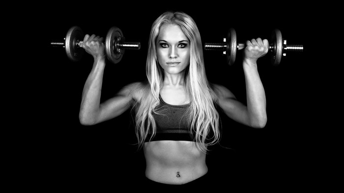 Woman lifting dumbbells