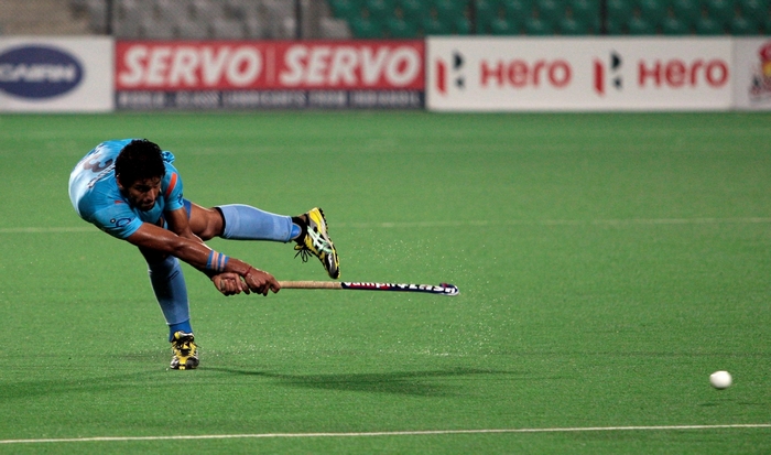 Indian hockey player in action on field