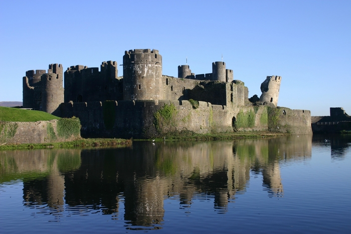 Caernarfon Castle reflected in water