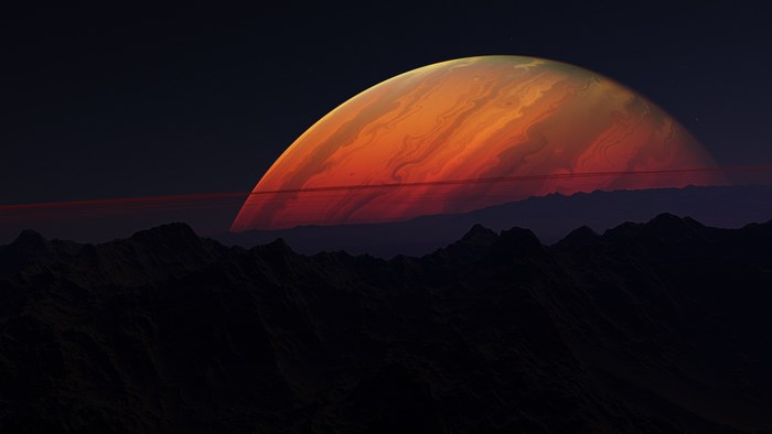 Majestic Red Planet Rising Over Mountain Silhouette