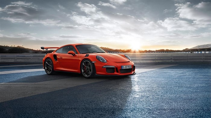 Red Porsche 911 GT3 on Race Track at Sunset