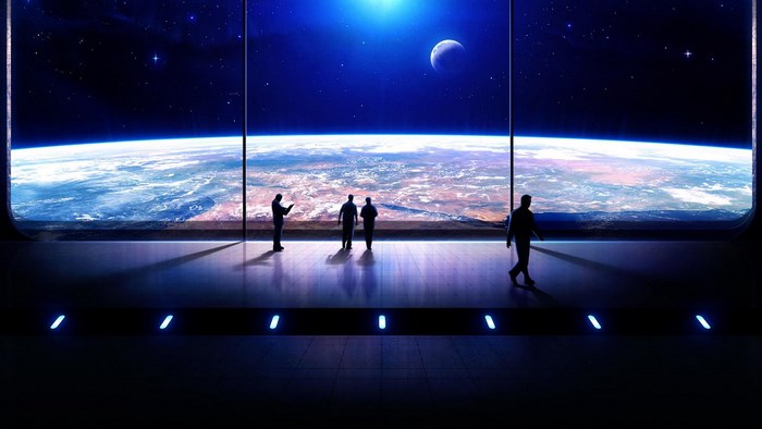People in a spaceship looking at Earth