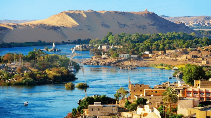 Aswan, Egypt: Nile River with Feluccas and Desert Landscape