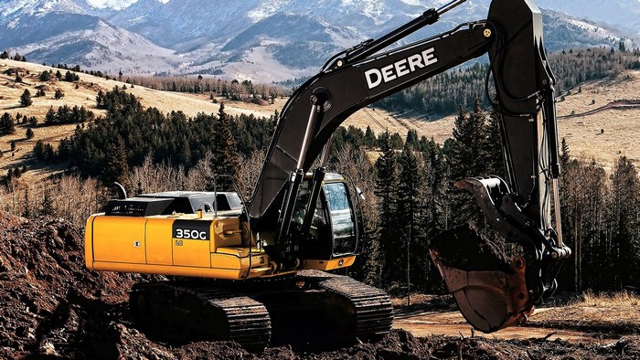 John Deere 350G excavator in a mountainous landscape