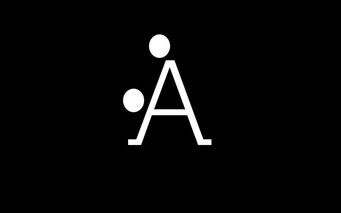 White letter A with two dots on black background