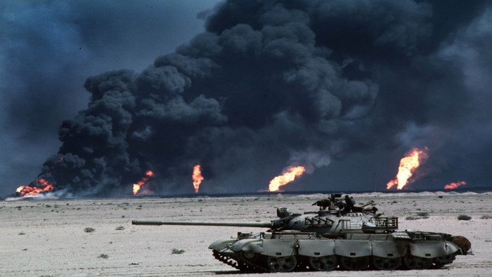 Tank in front of oil fires and smoke during Gulf War