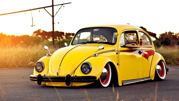 Yellow Volkswagen Beetle with red accents