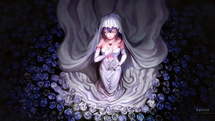 Bride in a white dress surrounded by blue roses