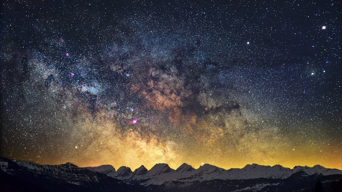 Milky Way over snow-capped mountains