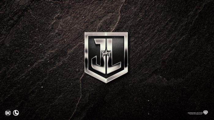 Justice League logo on dark stone background