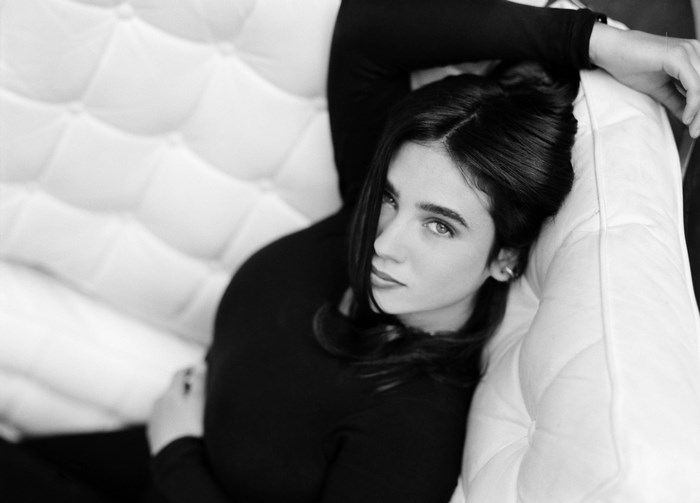 Jennifer Connelly on a white couch