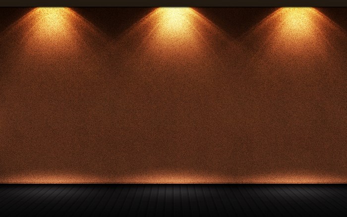 Spotlights on a textured wall and wooden floor