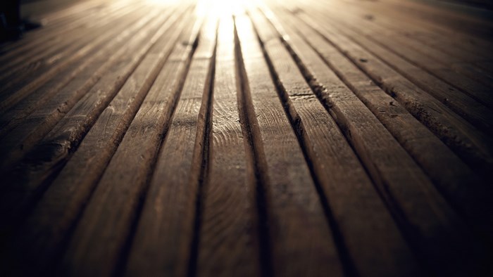 Wooden floor with light rays