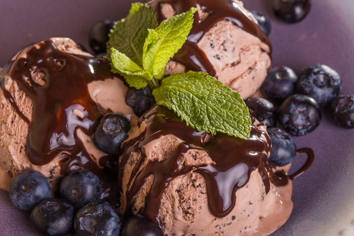 Chocolate ice cream with blueberries and mint