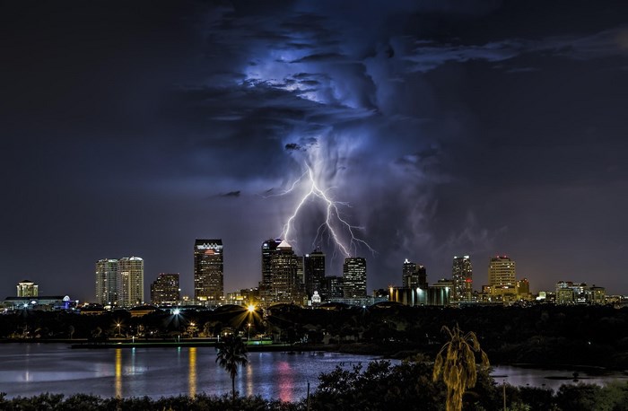 Lightning strikes over Tampa skyline at night
