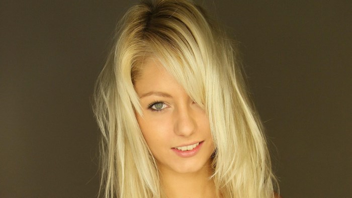 Close-up of Smiling Blonde Woman with Loose Hair