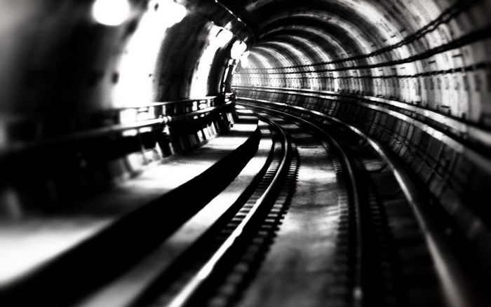 Subway tunnel with train tracks