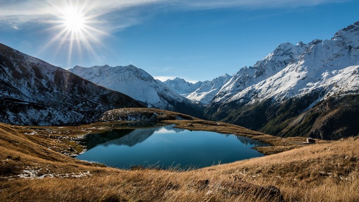 4K Mountain Lake with Sun and Snow