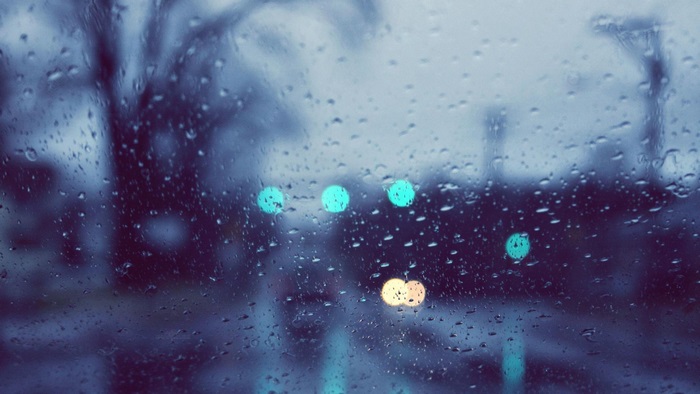 Rainy day through a window with bokeh lights