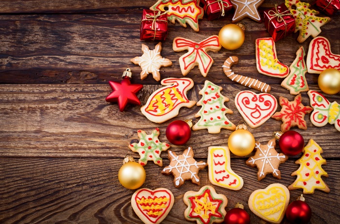 Christmas cookies and ornaments on wooden table