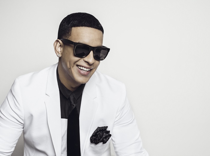 Daddy Yankee in a white suit and sunglasses