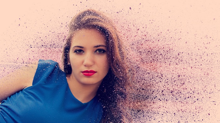 Woman with blue dress and particle effect