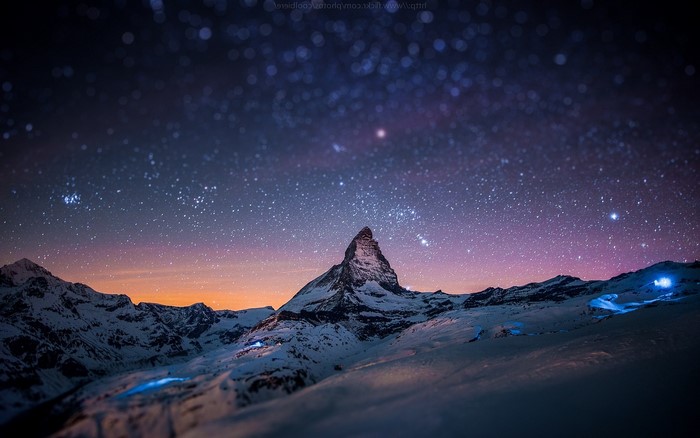 Matterhorn mountain under starry night sky in Switzerland