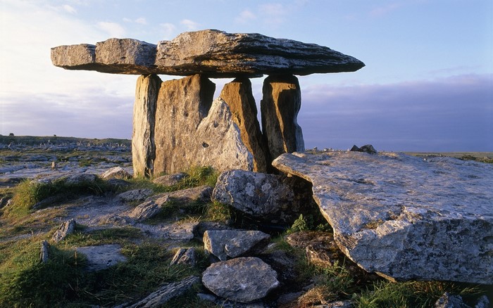 Ancient dolmen stone structure in a rocky landscape