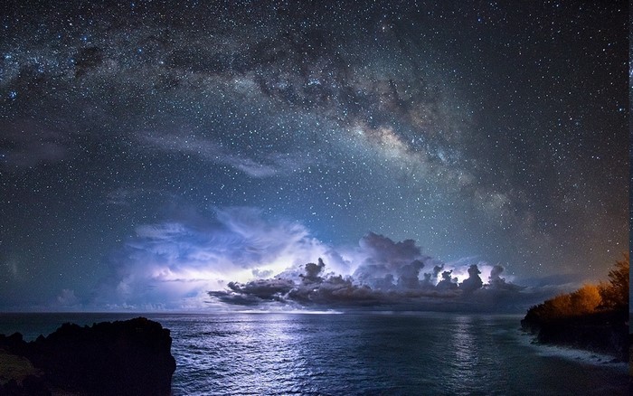 Milky Way Galaxy over Ocean with Lightning Storm