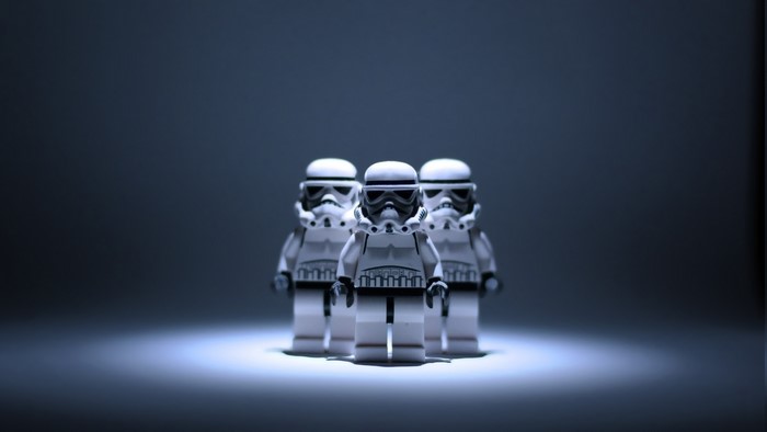 Three Lego Star Wars Stormtroopers in spotlight