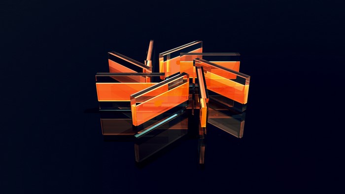Abstract orange glass facets on dark background