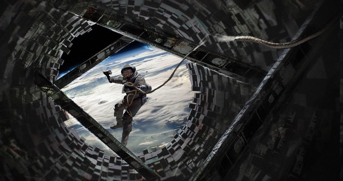 Astronaut tethered to space station above Earth