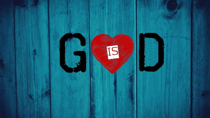 God is Love text on blue wood
