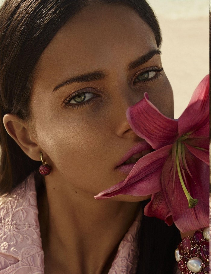 Adriana Lima with pink lily flower