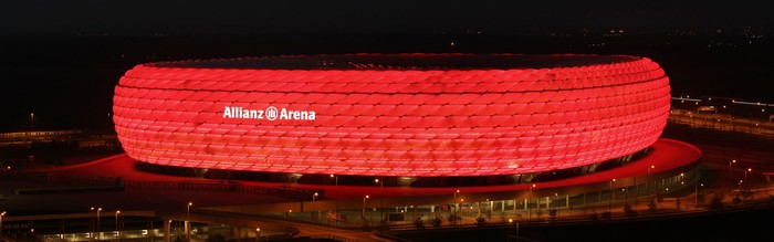 Allianz Arena stadium at night with red lights