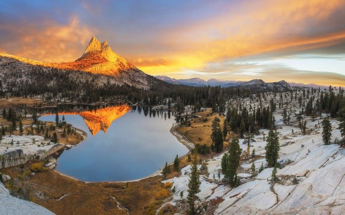 Mountain reflected in lake at sunset in Yosemite National Park