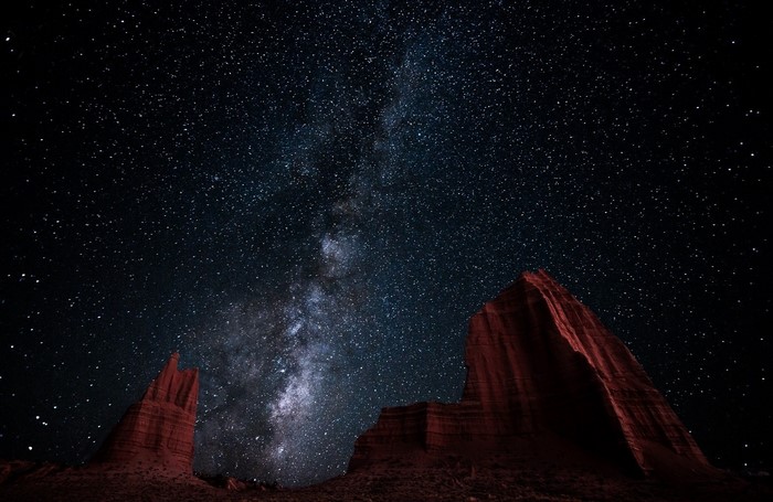 Milky Way over desert rock formations at night
