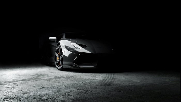 Black Lamborghini car with black rims