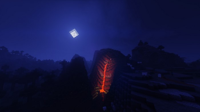 Minecraft landscape with lavafall under moonlight