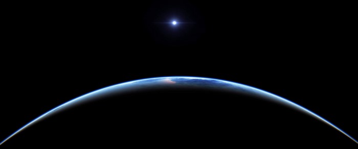 Earth from space with a bright star