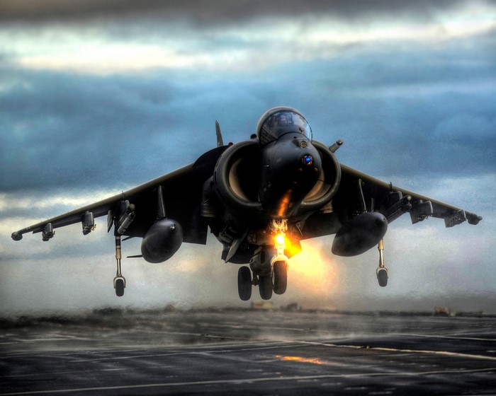 AV-8B Harrier II jet taking off from aircraft carrier