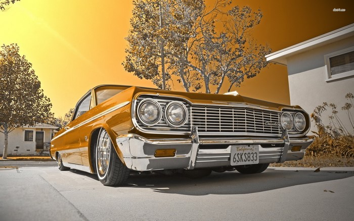 Lowrider Chevrolet Impala parked in a driveway