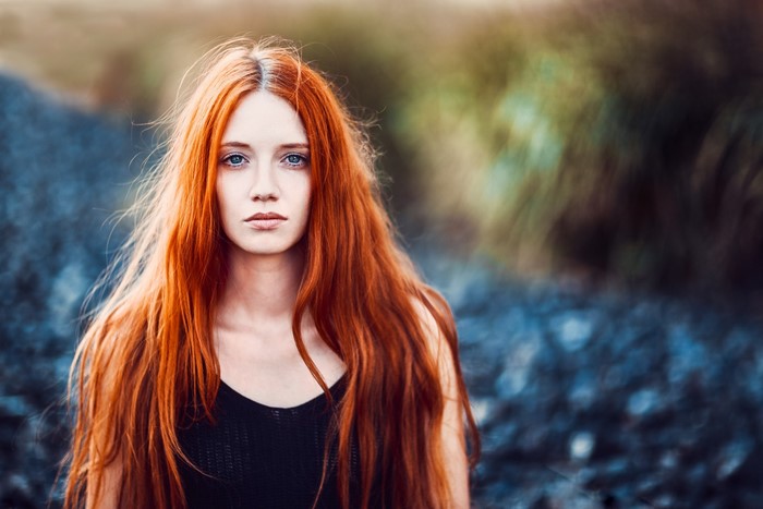 Redhead woman with long hair outdoors
