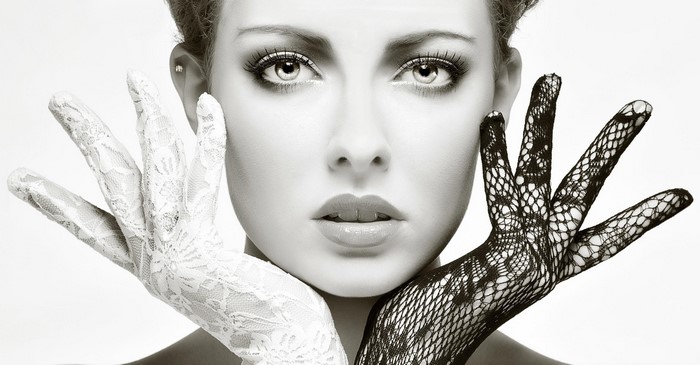 Woman with white and black lace gloves