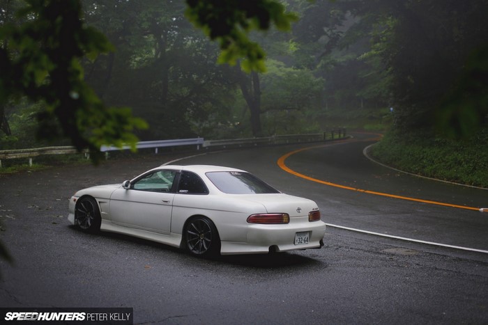 White Toyota Soarer on a Winding Road in Japan