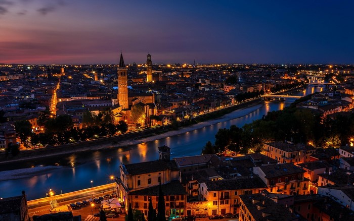 Cityscape of Verona, Italy at dusk with Adige River