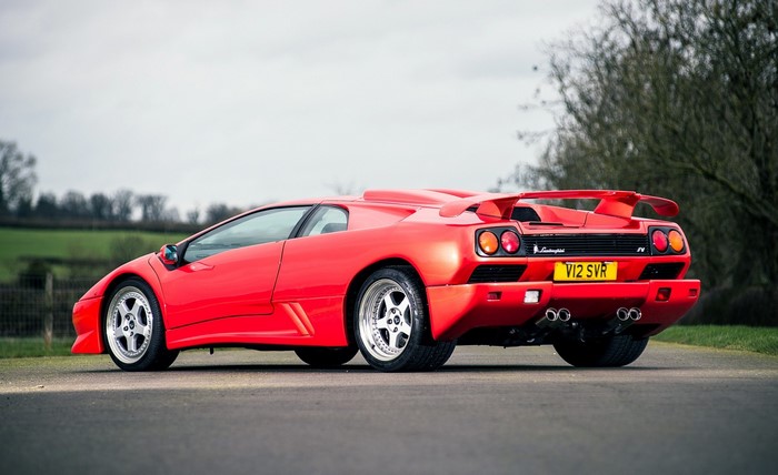 Red Lamborghini Diablo SVR parked on a road