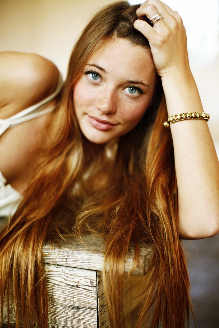 Redhead woman with blue eyes and freckles