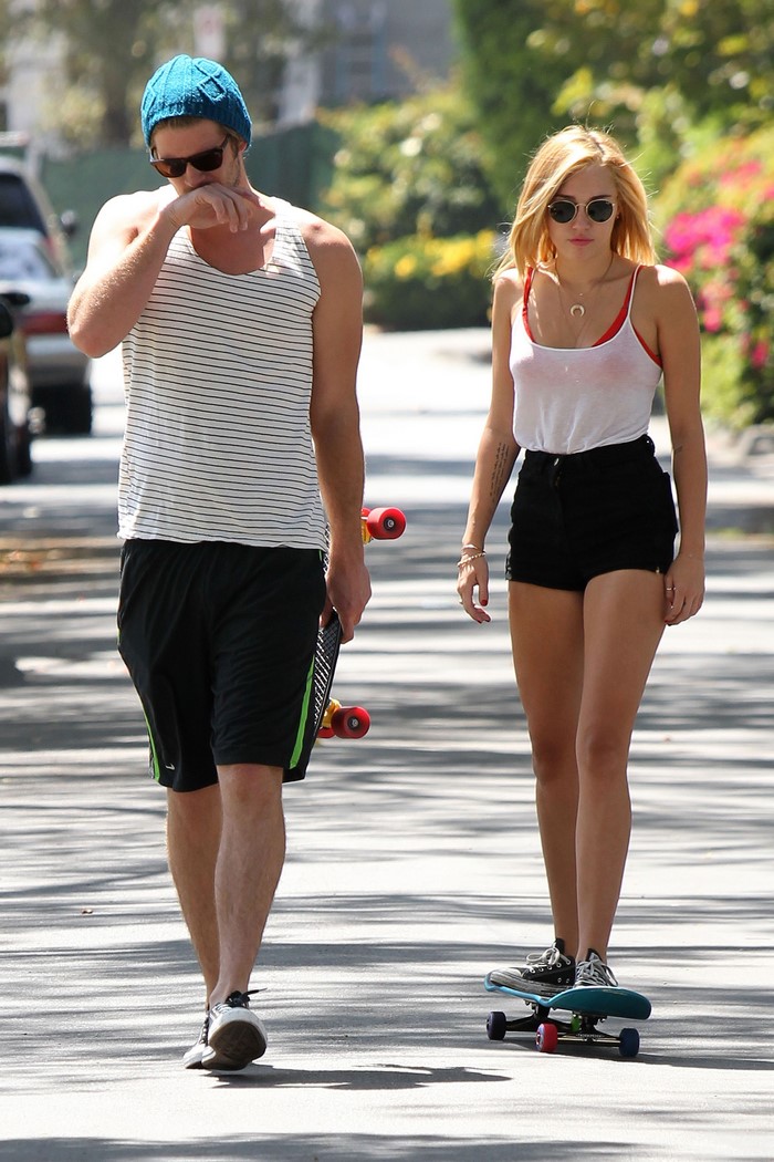 Liam Hemsworth and Miley Cyrus skateboarding